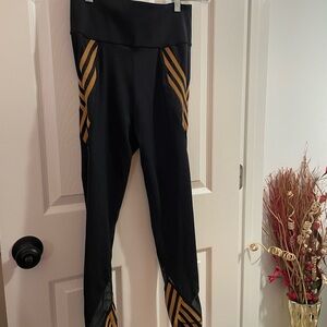 Adidas x IVY PARK Black and gold leggings 
Sz 40 = Sz 10 US